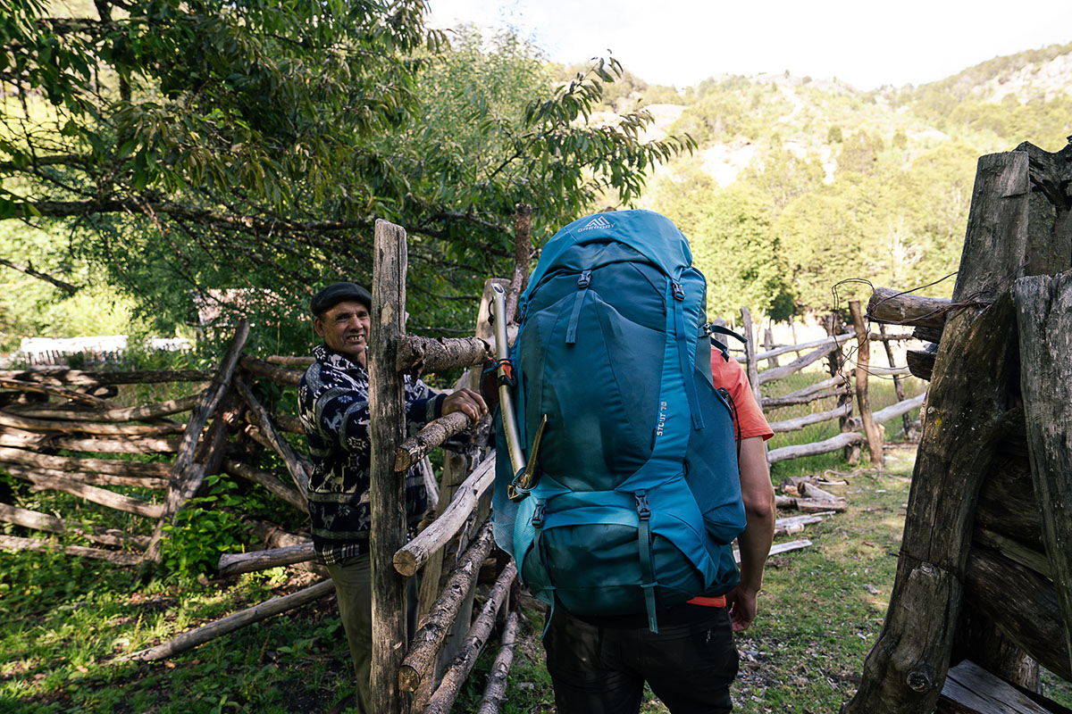 Gregory Stout 70 backpack (walking through gate)